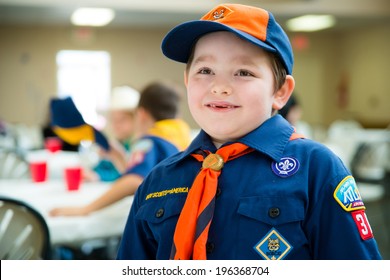 Happy Boy In Cub Scout Uniform At Annual Awards Banquet In Candid Image