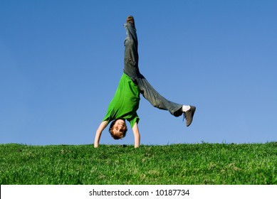 happy boy doing a cartwheel