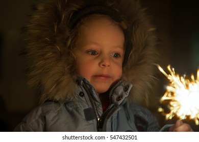 Happy boy with fireworks in his hands.

 - Powered by Shutterstock