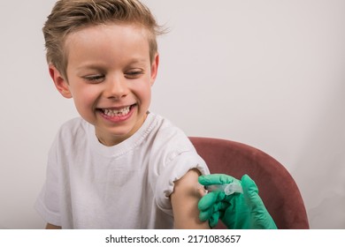 Happy Boy Getting Flu Shot. Cropped Nurse Giving Child Intramusc