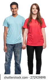 Happy boy and girl holding hands and smiling at camera. Studio shot on white background.
