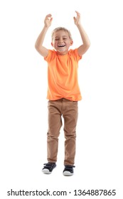 HAPPY BOY LAUGHING AND HOLDING HANDS UP WHILE MOVING ISOLATED ON WHITE BACKGROUND