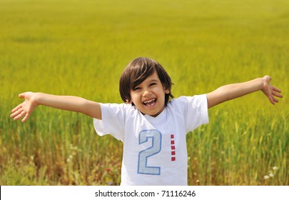 Happy Boy With Open Arms Outdoor