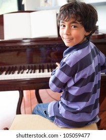 Happy Boy Playing The Piano At Home