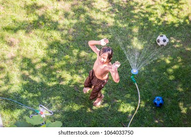 Happy Boy Playing Water Sprinkler Stock Photo 1064033750 | Shutterstock