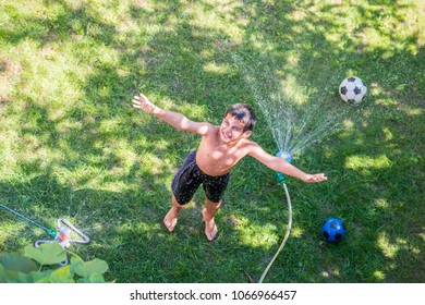 Happy Boy Playing Water Sprinkler Stock Photo 1066966457 | Shutterstock