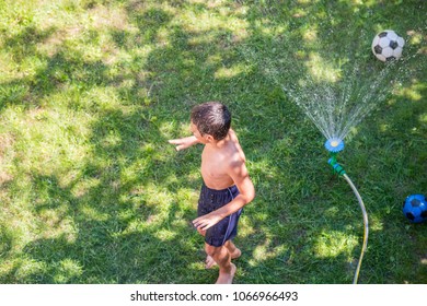 Happy Boy Playing Water Sprinkler Stock Photo 1066966493 | Shutterstock