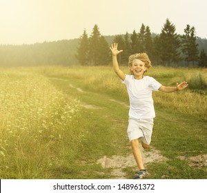 Happy Boy Running On Summer Field