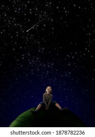 A Happy Boy Sitting On Top Of A Grassy Globe And Looking Up At A Sky Full Of Stars.