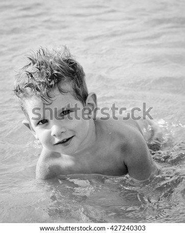 Similar – photo of an adorable boy learning to swim