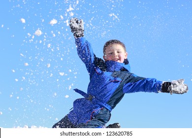 Happy Boy Throwing Snow