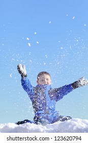 Happy Boy Throwing Snow