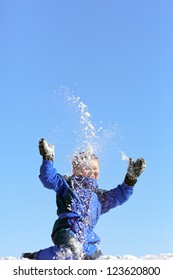 Happy Boy Throwing Snow