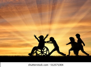 Happy Boy In Wheelchair Playing With Children Sunset. Concept Happy Child Disabled