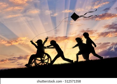 Happy boy in wheelchair playing with children and kite sunset. Concept happy child disabled - Shutterstock ID 512571358