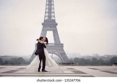 Happy bride and groom enjoying their wedding in Paris - Powered by Shutterstock