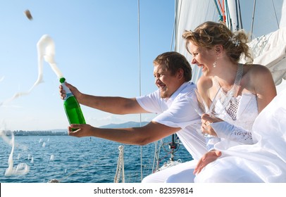 Happy bride and groom on a  yacht