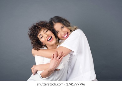 Happy bright positive moments of two stylish girls hugging each other and smiling. Closeup portrait funny joyful attractive young women having fun, lovely moments, best friends. - Shutterstock ID 1741777796