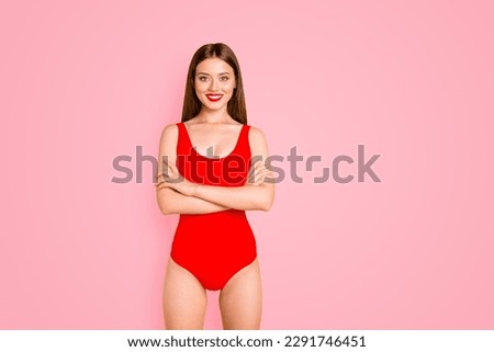 Happy brunett girl with big smile looking at camera crossed her arms over her chest isolated on vivid yellow background with copy space