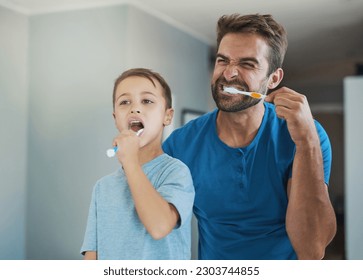 Happy, brushing teeth and father with son in bathroom for morning routine, bonding and dental. Oral hygiene, cleaning and smile with man and child in mirror of family home for self care and wellness - Shutterstock ID 2303744855