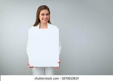 Happy Buisness Woman In White Suit Holding White Sign Board. Isolated Female Portrait.