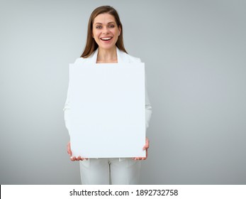 Happy Buisness Woman In White Suit Holding White Sign Board. Isolated Female Portrait.