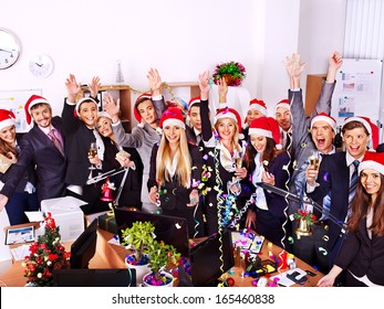 Happy business group people in santa hat at Xmas party.
