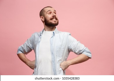 Happy business man standing and smiling isolated on pink studio background. Beautiful male half-length portrait. Young emotional man. The human emotions, facial expression concept. Front view. - Shutterstock ID 1035428383