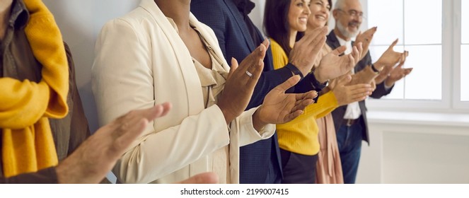 Happy business people clapping hands thanking coach for interesting lecture. Diverse male and female audience giving round of applause to express respect and gratitude to speaker. Banner background