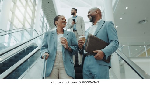 Happy business people, coffee and laughing on escalator for funny joke, discussion or morning at airport. Businessman and woman smile with latte or cappuccino down a moving staircase for work travel - Powered by Shutterstock