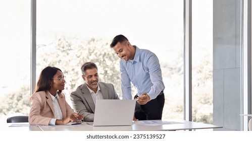 Happy business people executive team working at laptop using computer having discussion at office professional meeting showing financial project results consulting client investor at workplace. - Powered by Shutterstock