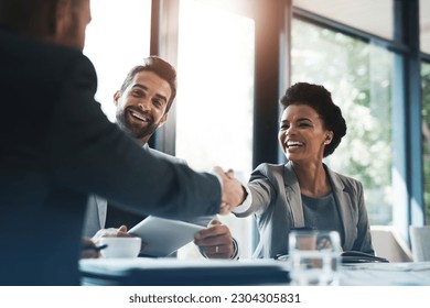 Happy business people, handshake and meeting in teamwork for partnership or collaboration in boardroom. Woman person shaking hands in team recruiting, introduction or b2b agreement at the workplace - Powered by Shutterstock