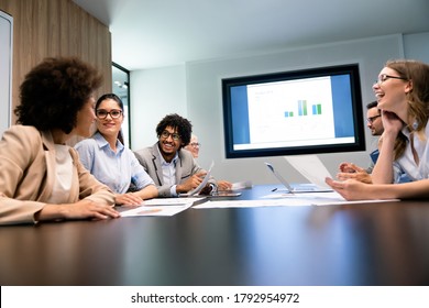 Happy Business People Having Fun And Chatting At Workplace Office