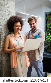 Happy Business People Having Fun And Chatting At Workplace Office. Flirting At Work