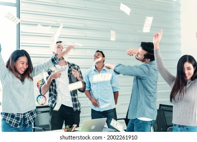 Happy business people holding dollar money and throw in the air celebrate happiness dance wealth lottery money rain drop concept. Success business cash flow corporate coworkers in company. Happy money - Powered by Shutterstock