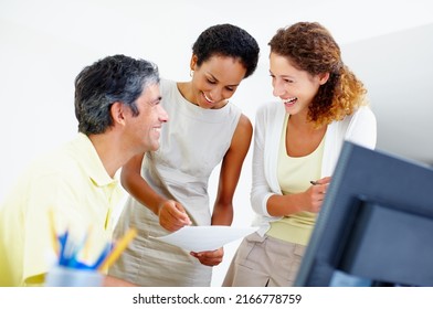 Happy Business People Taking A Look At Paperwork. Happy Business People Smiling And Looking At Each Other With Woman Holding Paperwork.