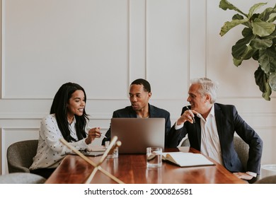 Happy Business People Using A Laptop