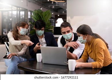 Happy Business people working together in public places on a day that covid 19 virus are epidemics. They wear surgical masks to prevent the outbreak of corona virus, influenza or dust allergy. 