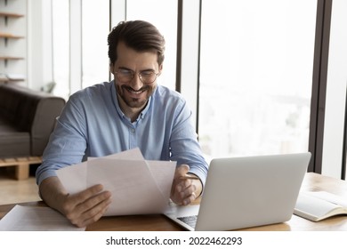 Happy Business Professional In Glasses Reviewing Official Legal Documents, Reading Received Paper Letter With Good News, Bank Notice, Approved Loan Agreement. Paperwork, Correspondence Concept