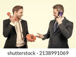 Happy business professionals use classic telephone and cell phone isolated on white, communication