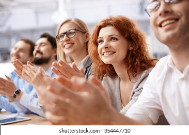 Happy Business Team Applauding At Conference