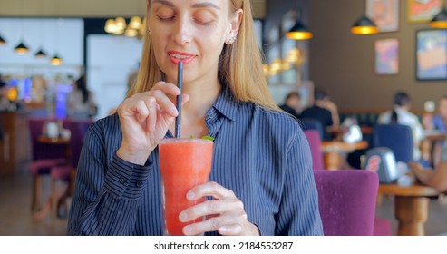 Happy Business Woman Drinking Healthy Strawberry Banana Smoothie From Straw