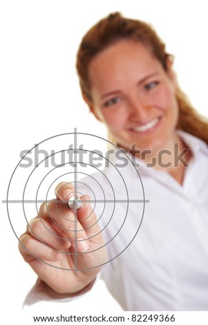 Happy business woman holding a pen to crosshair