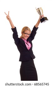 Happy Business Woman Holding A Trophy And Making A Victory Gesture