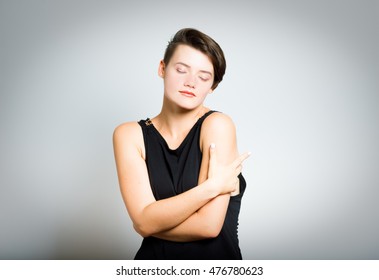 Happy Business Woman Hugging Herself With Closed Eyes And Natural Emotional Face. Love Concept Of Yourself. Toned Portrait