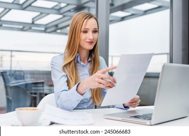 Happy Business Woman Reading Financial Report