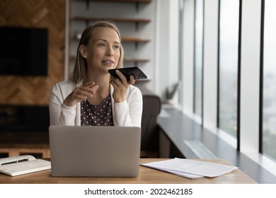 Happy Business Woman Recording Audio Message On Cellphone At Workplace, Making Phone Call On Speaker, Giving Audio Command To Virtual Assistant For Online Search, Using Voice Recognition App