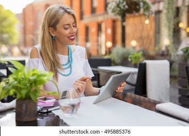 Happy Business Woman Using Tablet