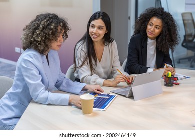 Happy Business Women Having A Reunion In The Office And Looking At Graphics.