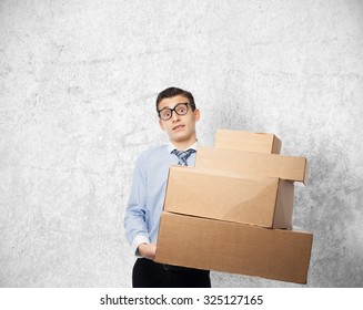 happy businessman with boxes - Shutterstock ID 325127165